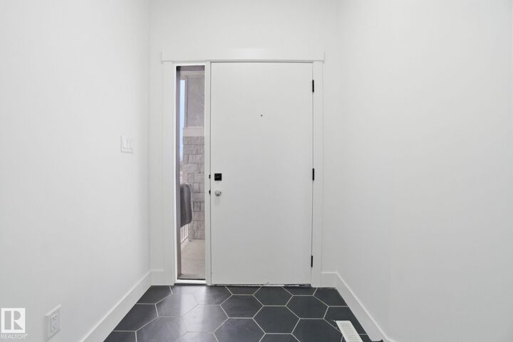 Property Photo: 3311 Chernowski Way SW AB T6W 5H2