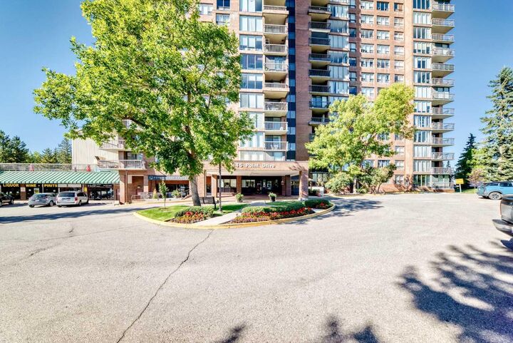 Property Photo: 145 Point Drive NW 1708 AB T3B 4W1