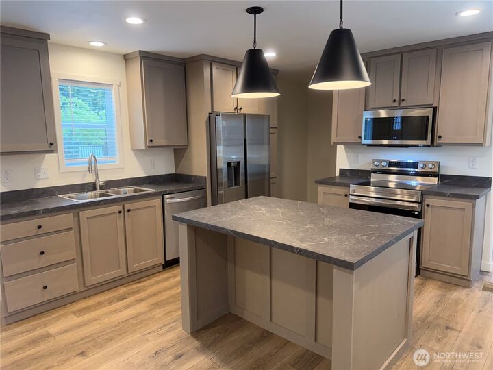 Property Photo:  375  Union Avenue SE 8  WA 98059 