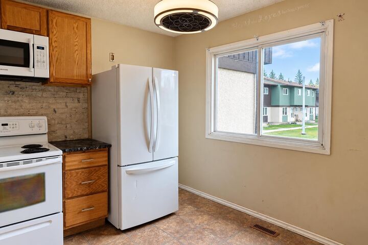 Property Photo:  7817 Cedarwood Park  AB T8V 4R8 