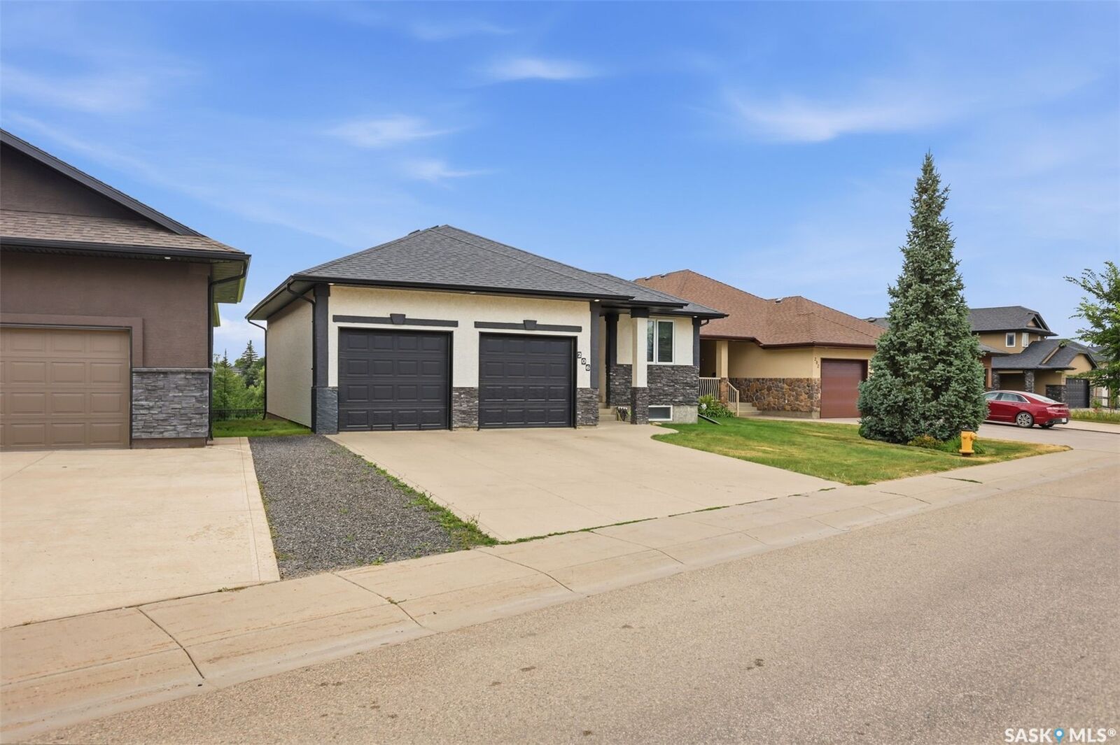 Property Photo:  206 Muzyka Road  SK S7W 0G9 