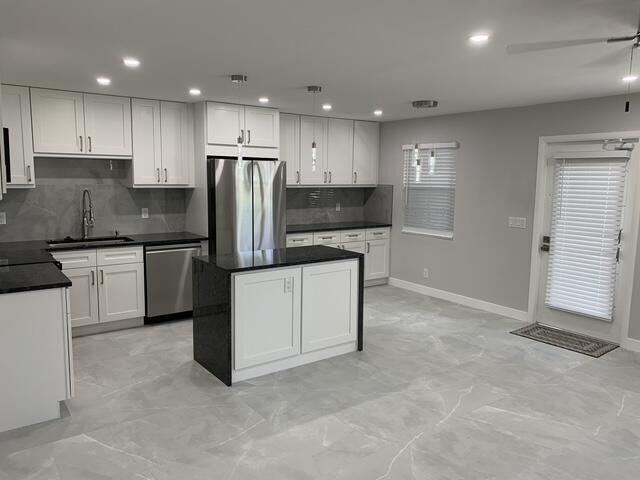 Property Photo:  1064 Exeter D  FL 33434 