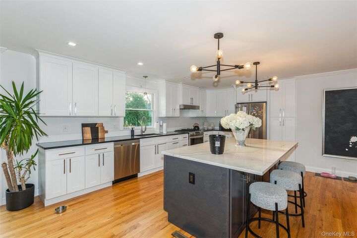 Property Photo:  1402 Merrick Avenue  NY 11566 