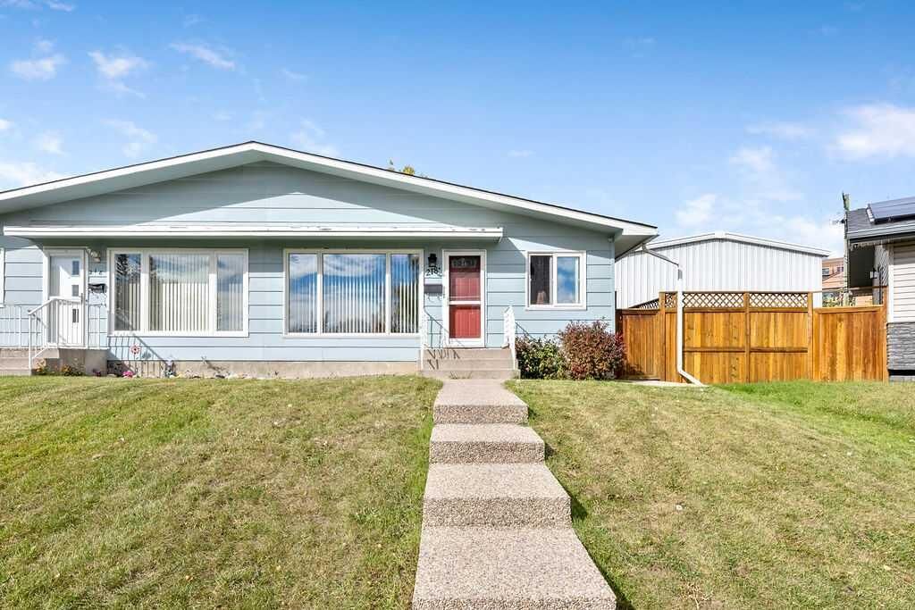 Property Photo:  218A Allan Crescent SE  AB T2J 0T4 