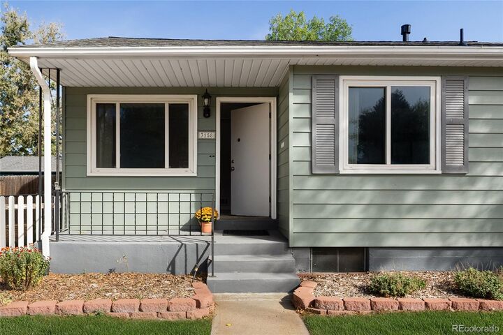 Property Photo:  3158 S Fox Street  CO 80110 
