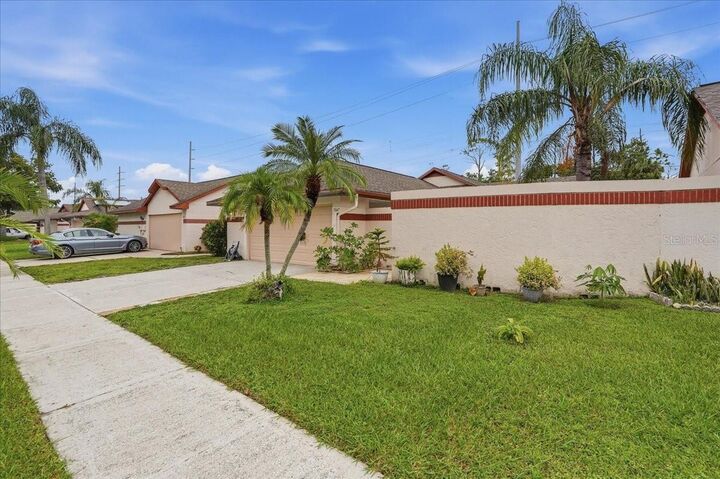 Property Photo:  7047 Silvermill Drive  FL 33635 