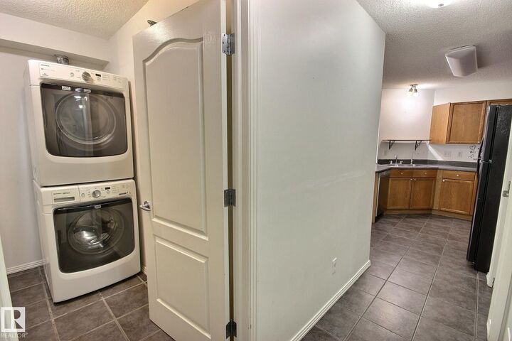 Property Photo:  12838 65 Street NW 218  AB T5A 5H3 