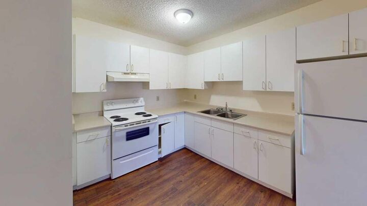 Property Photo:  5117 44 Street 302  AB T0G 1E0 