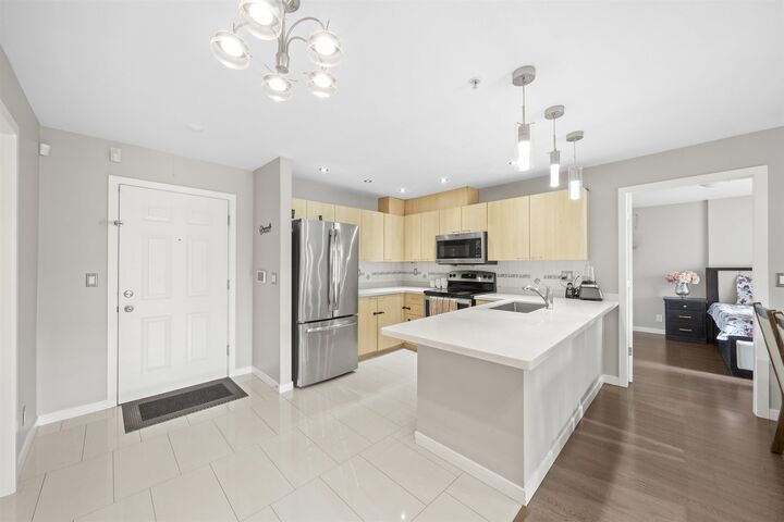 Property Photo:  12083 92A Avenue 207  BC V3V 8C8 