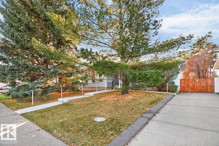 Property Photo:  8711 38A Avenue NW  AB T6K 0E7 