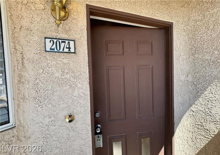 Property Photo:  8501 West University Avenue 2074  NV 89147 