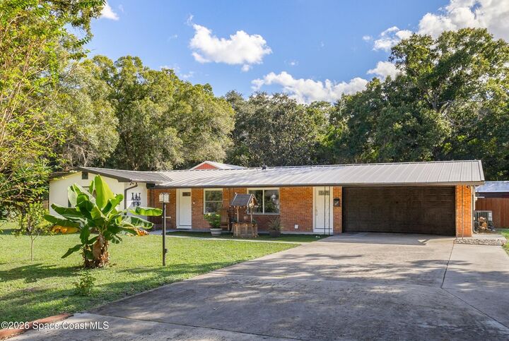 Property Photo:  6597 Norman Drive  FL 32904 