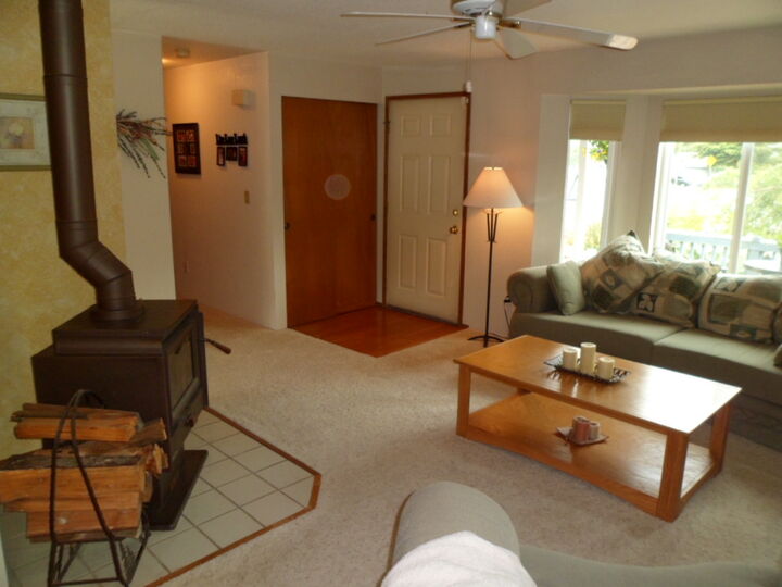 Property Photo: A. hard wood entry leads into formal living room w/ freestanding stove. 1122 103rd Dr SE WA 98258