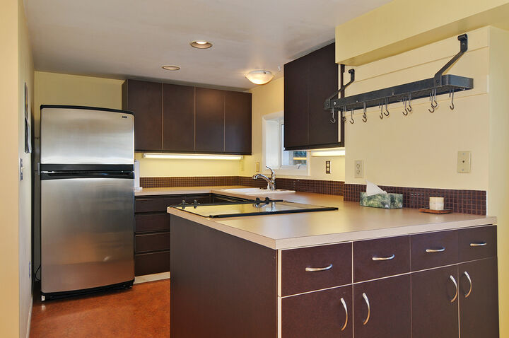 Property Photo: Dining room, kitchen, living room 435 11th Ave E 3 WA 98102